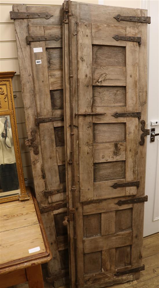 A pair of doors with shutters W.56cm